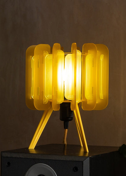 Mini Poppy lamp in Lemon yellow styled on a neutral-toned sideboard. Its vibrant yet soft glow brightens the space without overpowering it — a fresh choice for Scandinavian-inspired interiors and sunny flat living.