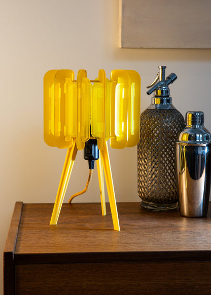 The Lemon Mini Poppy adds a joyful glow to a minimalist space. Compact, colourful, and handmade in the UK, it's a versatile lighting accent for cheerful home decor and thoughtful gift ideas.