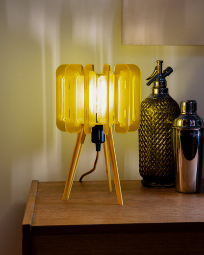 A close-up of the Lemon Mini Poppy lamp showing its layered yellow tones and delicate, laser-cut acrylic surface. The citrus-inspired colourway makes it ideal for colour lovers, bold interior accents, and uplifting home decor.
