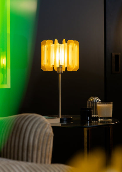 The Lemon Mini Poppy lamp glows in two tones of citrus yellow, adding a bright, zesty pop to a clean, contemporary space. Perfect for bringing joyful colour and soft ambient light to modern homes, shelf styling, or bedside tables.

